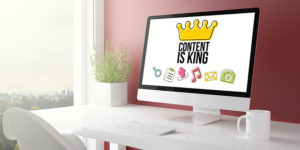 red studio with content is king computer | content marketing strategies